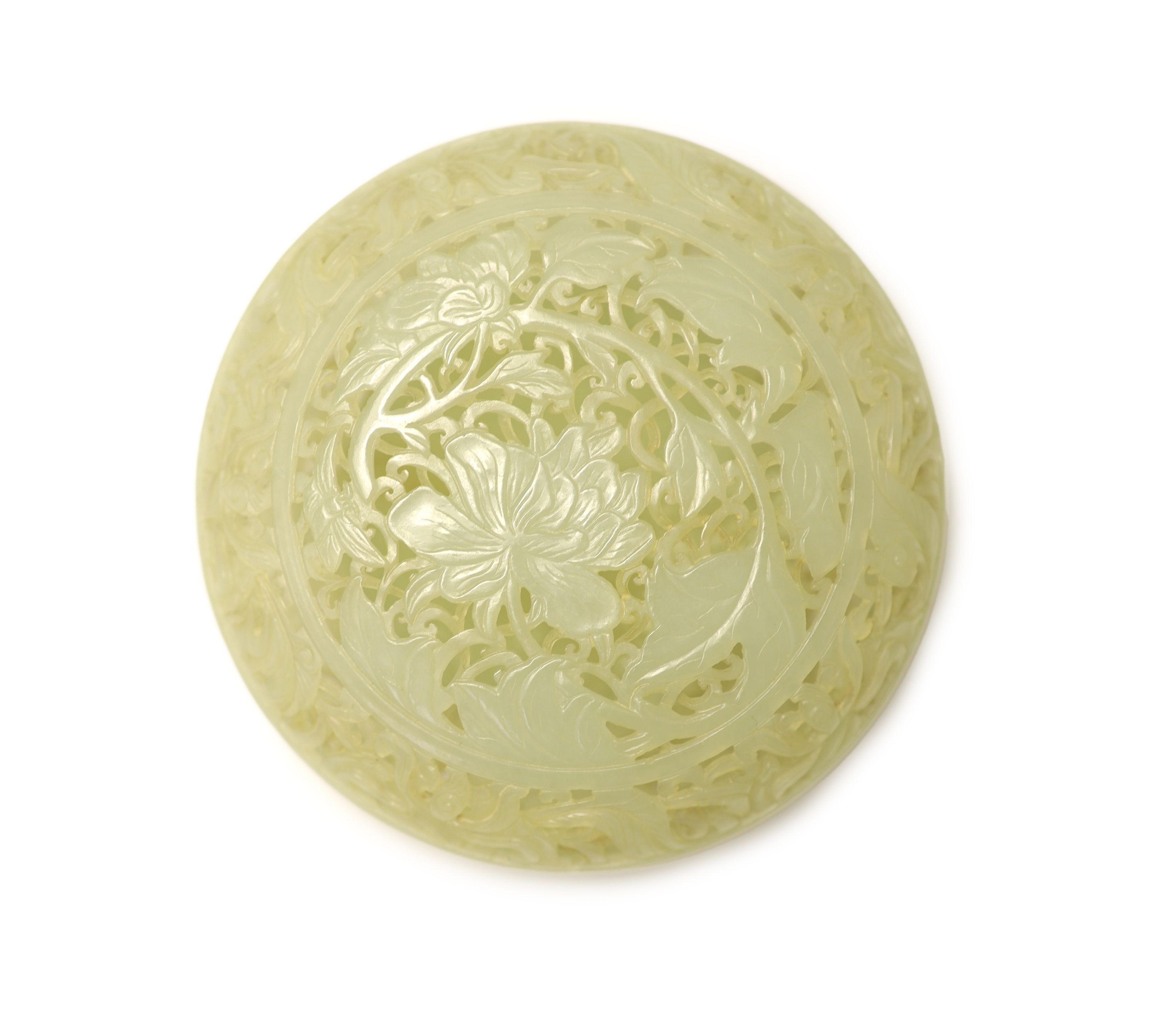 A fine Chinese pale celadon jade reticulated box and cover, 18th century, 9cm diameter, wood stand